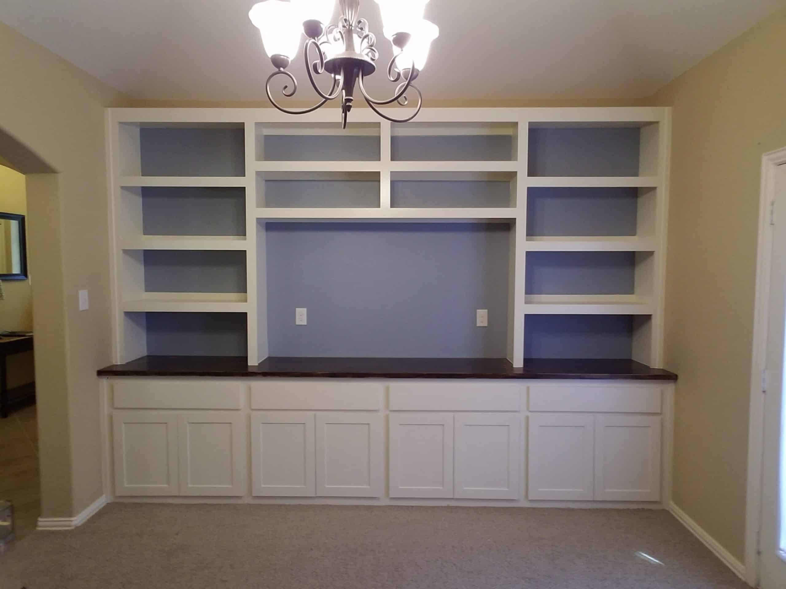 new living room storage shelves installed by our home storage handyman team