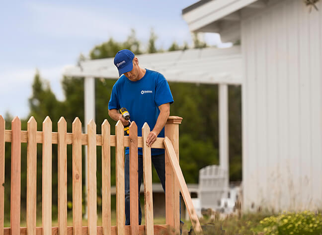 handyman in Caldwell, ID, installing new wooden fence for home