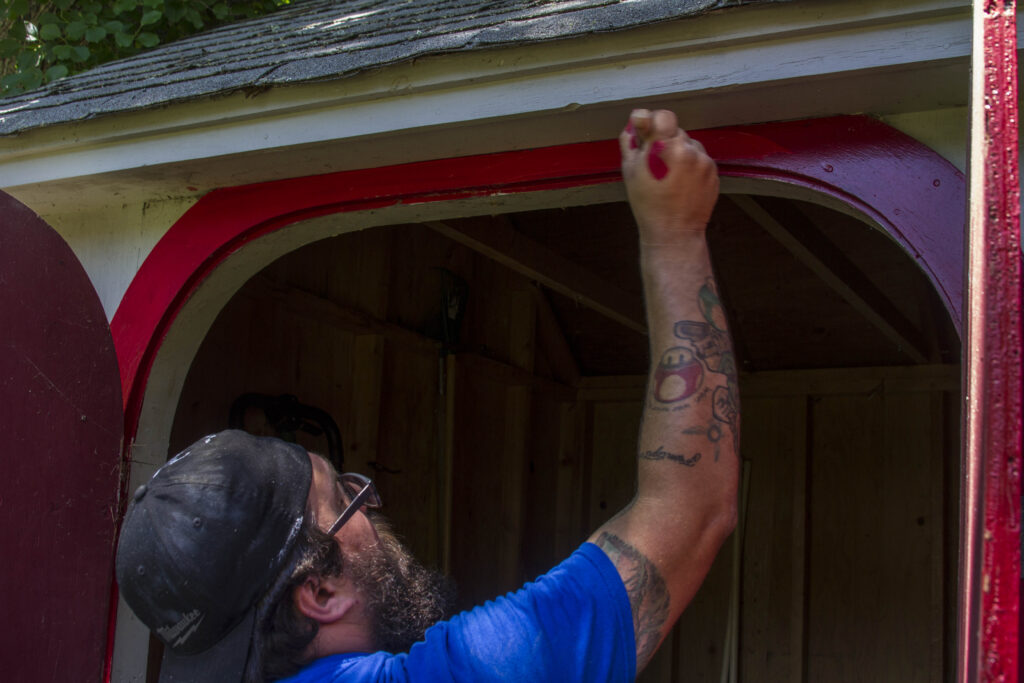 painting handyman in Caldwell, ID, painting exterior trim of a shed