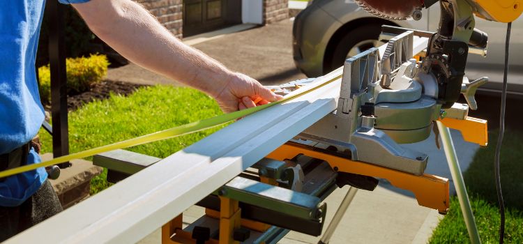 https://handymanconnection.com/calgary/wp-content/uploads/sites/14/2025/08/Handyman-Using-Circular-Saw-Cutting-Crown-Moulding-for-Renovation.jpg