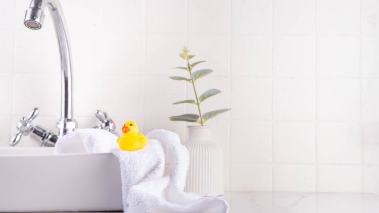 Bathroom background with sink and faucet