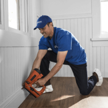 craftsman using nail gun for remodeling job