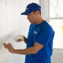 handyman repairing drywall