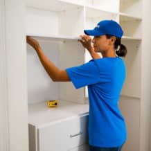 handyman working on home storage