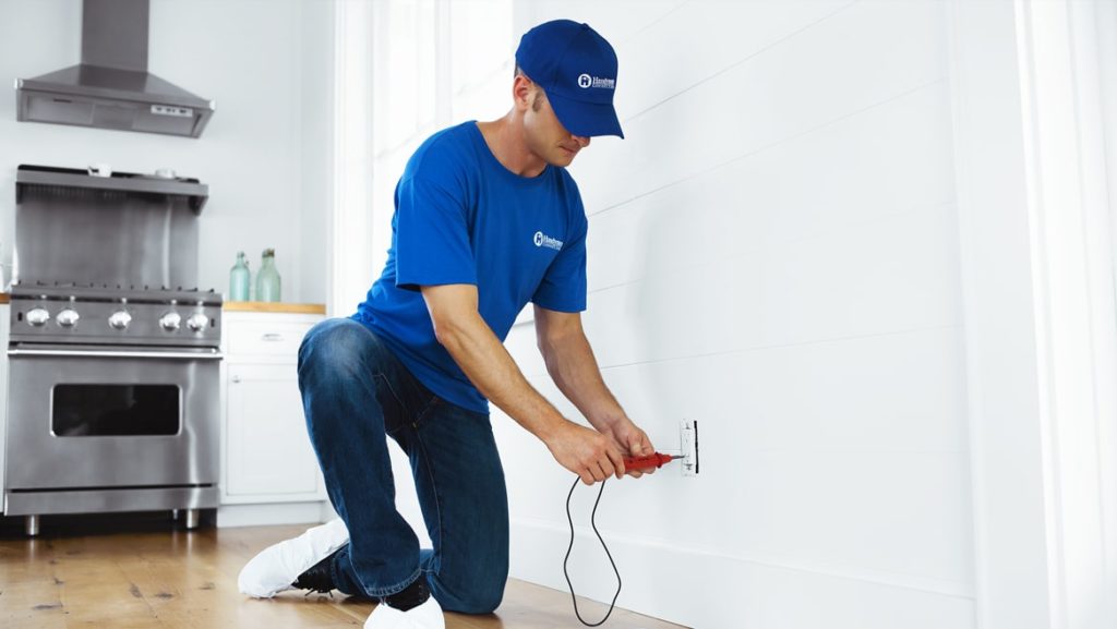 professional electrical handyman installing a new electrical outlet in Lakeville, MN