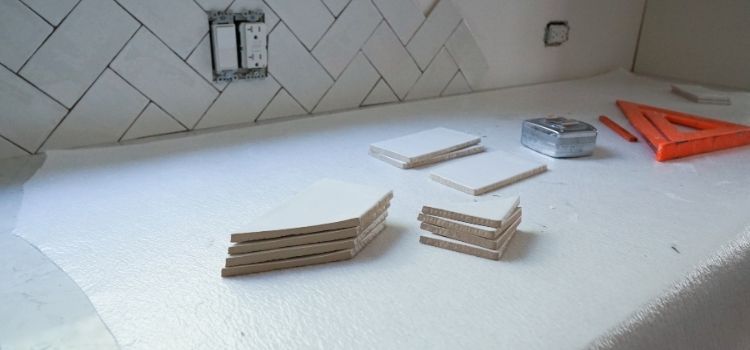 Installing a white kitchen tile backsplash