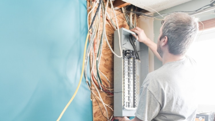 electrician upgrading a homes distribution board