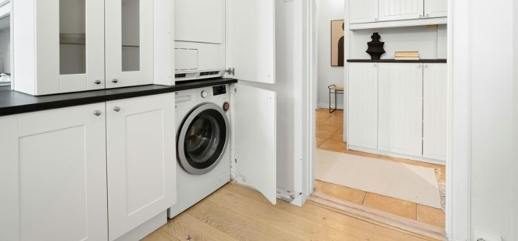 Modern Laundry Room with Washer and Cabinets