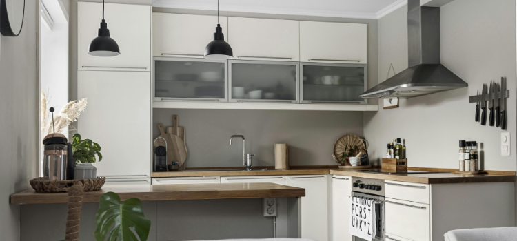 Small Clean Kitchen with Hanging Light Fixtures