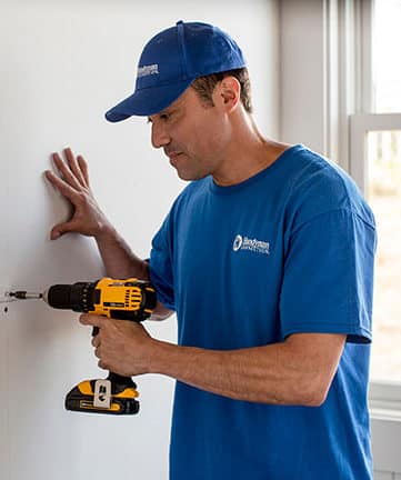 handyman installing drywall