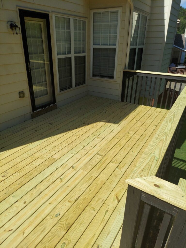 deck repair job completed with new deck boards and railings