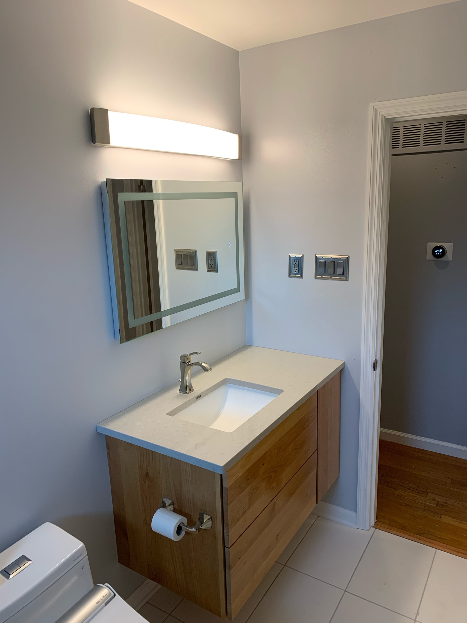 Lexington-area bathroom remodel with clean, modern sink fixtures