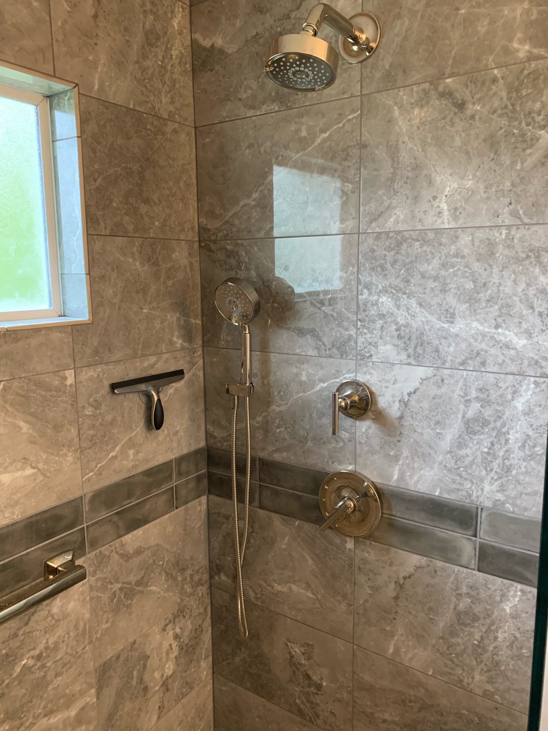 Lexington-area shower remodel with brand new shower head and fixtures