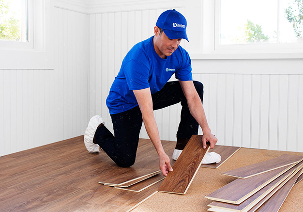 handyman in Hickman, NE, installing new hardwood flooring 