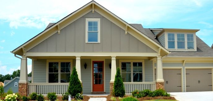 Craftsman-Style Home With Porch Columns on a Bright, Sunny Day