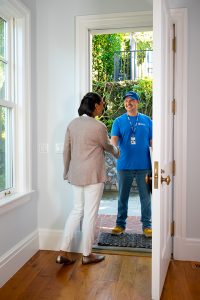 handyman shaking hands with customer