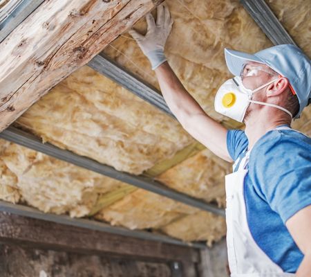 Man installing insulation