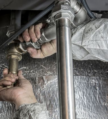 Plumber Installs Pipe Fittings