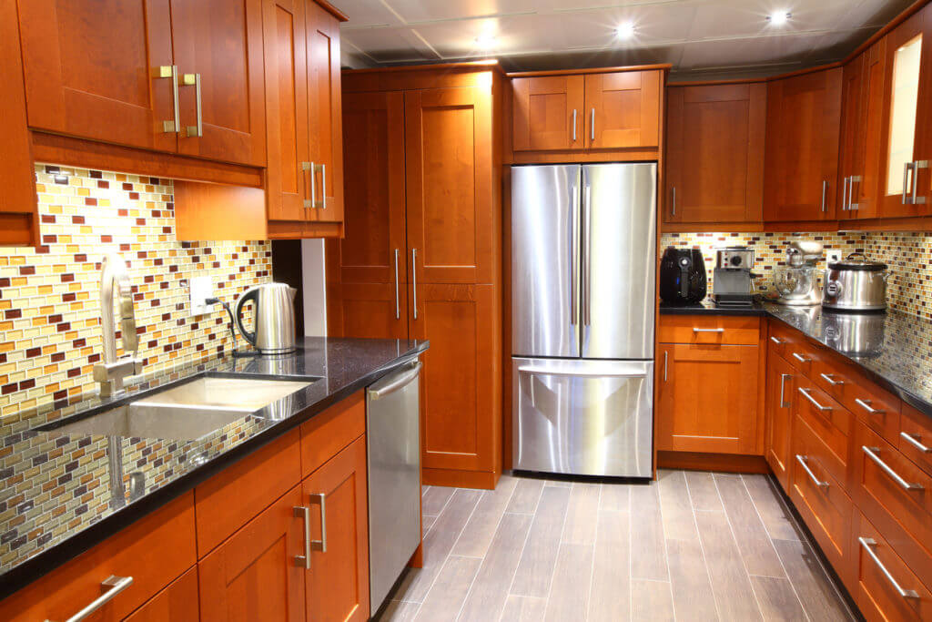 kitchen remodel completed with new cabinets and countertops installed by our craftsmen