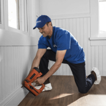 handyman using nail gun