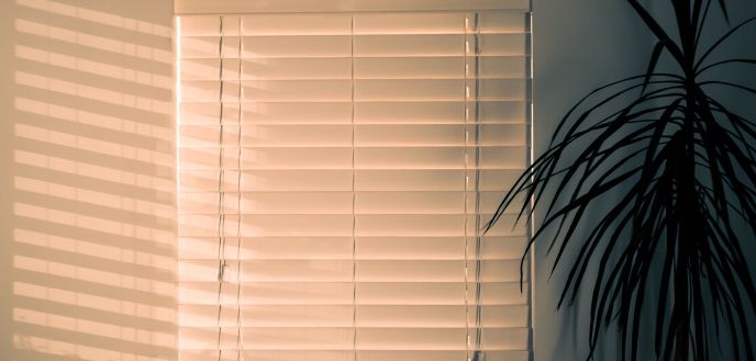 White Blinds in a Dimly Lit Room