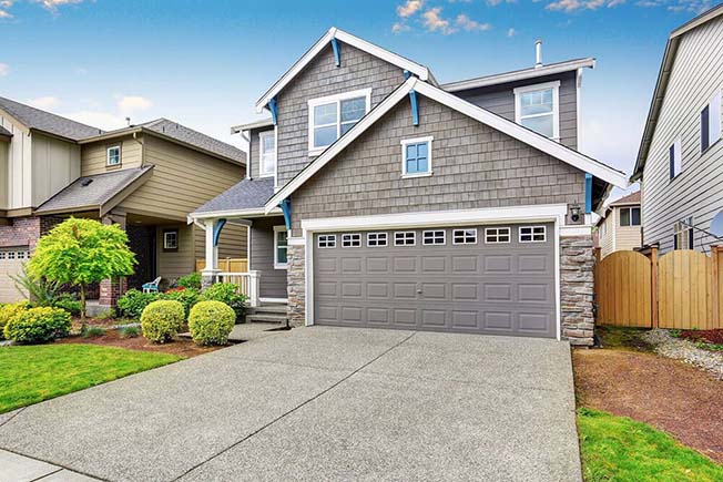 https://handymanconnection.com/wp-content/uploads/2021/05/bigstock-Nice-Curb-Appeal-Of-Two-Level-138618230.jpg